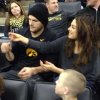 rs_600x600-131222125417-600.Ashton-Kutcher-Mila-Kunis-Iowa-Game.jl.122213.jpg